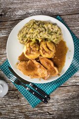 Stewed turkey meat in gravy.