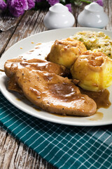 Stewed turkey meat in gravy.