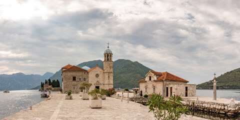 Beautiful panorama of Our Lady of the Rocks (Gospa od Skrpjela) island and church near Perast in the Bay of Kotor, Montenegro. One of the two islets off the coast of Perast