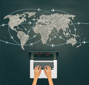 Laptop and world travel map