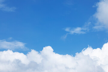 Obraz na płótnie Canvas Blue sky background and white clouds soft focus, and copy space