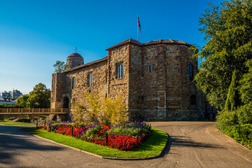 A view across the park and ground of Norman castle at Colchester UK in the summertime