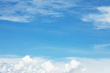 Blue sky background and white clouds soft focus, and copy space