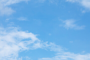 Blue sky background and white clouds soft focus, and copy space