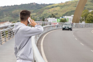 man on the road with mobile phone