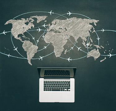 Laptop and world travel map