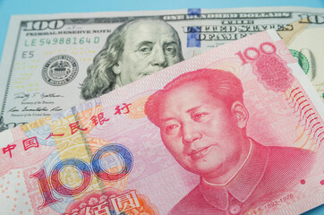 US dollar bill and China yuan banknote macro, Chinese and USA economy finance trade business, money closeup, forex concept.