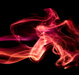 Red smoke on black background