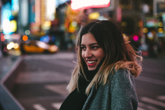 Happy young woman in the city