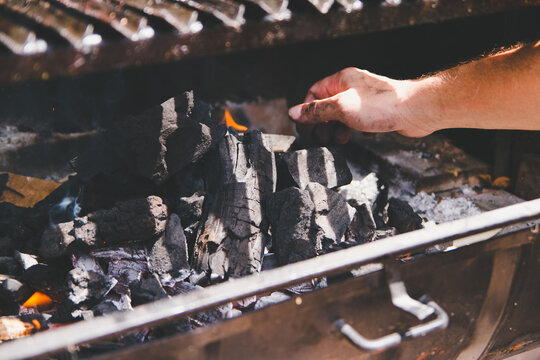 Starting fire on charcoal barbecue