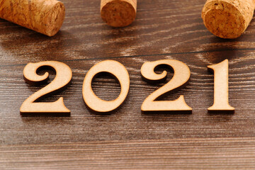 Happy New Year. The number 2021 on brown background.