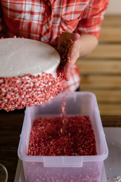 Young woman making a birthday cake
