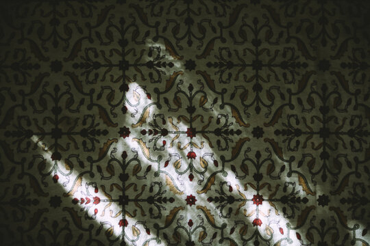 Window light on a floreal linen cloth