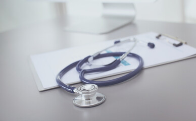 Fototapeta na wymiar Medical equipment: blue stethoscope and tablet on white background. Medical equipment
