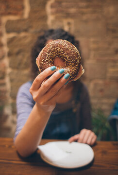 Woman eating a bagel