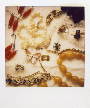Polaroid Photograph Of A Collection Of Vintage Costume Jewelry