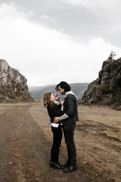 romantic couple embraces in beautiful landscape