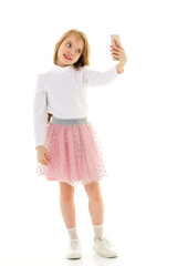 Fototapeta premium The girl is using a cell phone.The concept of people and technology.