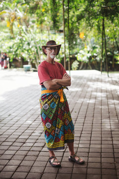 Mature caucasian man wearing sari at Pura Tirta water temple in