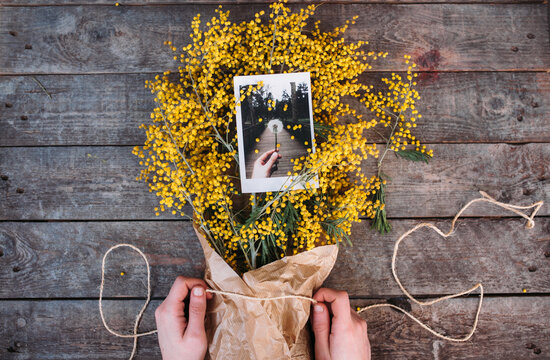 mimosa bouquet with a picture of a dandelion on