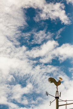 Weather Vane against Blue Sky