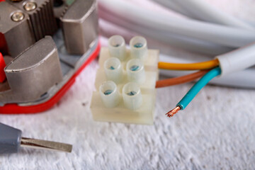 Electric cord and tools for installation. Electrical accessories for the production worker.