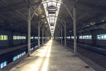 Inside a rural hangar under construction. Construction of an agricultural building. Future empty new barn
