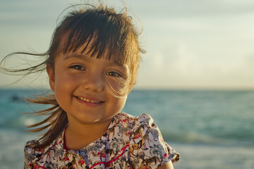 Headshot of young little girl smiling