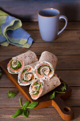 Salmon and cream cheese wraps. Rolls with smoked salmon. Homemade tasty burrito