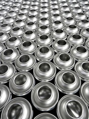 silver empty aerosol cans awaiting manufacturing process in factory