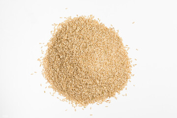 Pile of brown rice on white background