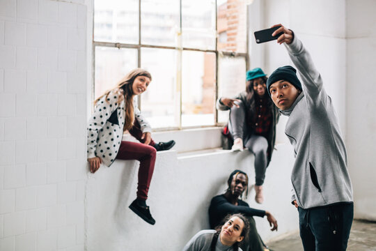 Hip-hop friends taking a selfie after a workout.