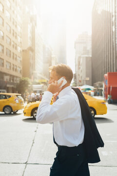 Businessman On the Phone Walking in Manhattan Heading To Work ,