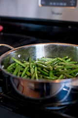 sautéing green beans in frying pan