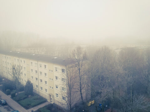 Heavy fog over post-war residential area