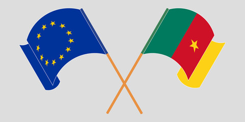 Crossed and waving flags of Cameroon and the EU