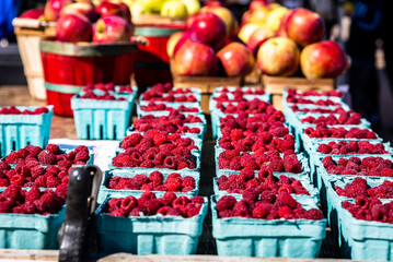 Raspberries and Apples for sale at the market