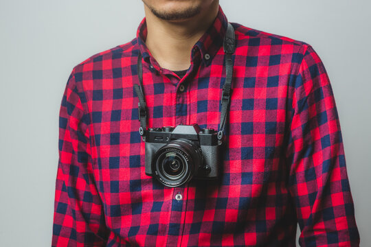 Digital Mirrorless Camera on a Plaid Shirt