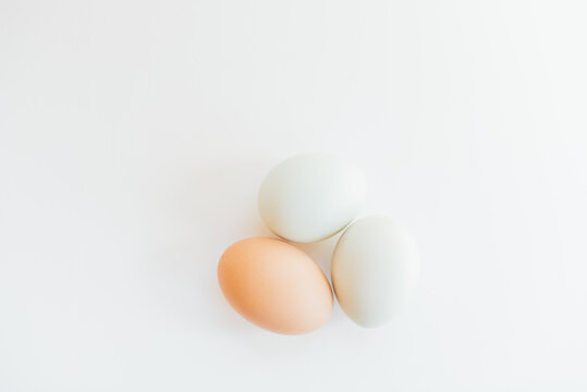 three eggs on white background