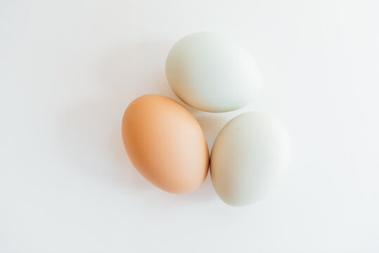 three eggs on white background