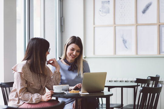 Businesswomen on Coffee Break at Cafe