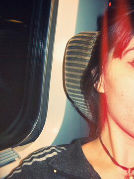 Woman on train: an effaced self-portrait