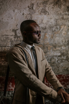 African American Businessman Portrait over a Grunge Wall