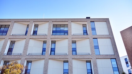 Obraz premium Multistoried modern, new and stylish living block of flats. Newly built apartment building.