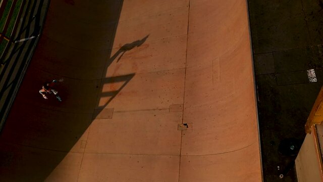 Bird&rsquo;s Eye View of Girl Roller Skating on Halfpipe Ramp