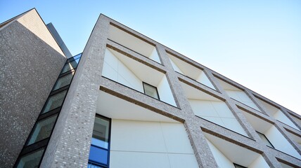 Multistoried modern, new and stylish living block of flats. Newly built apartment building.