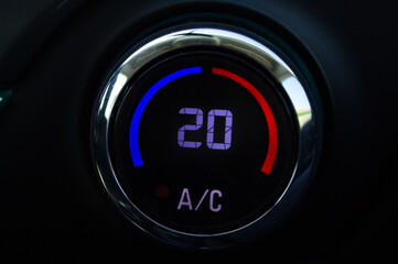 Button to turn on a car's air conditioning.