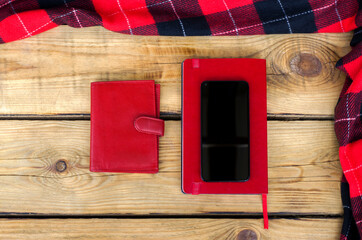 Red Wallet, Red Diary and Smart Phone on wooden background. Top view. Christmas shopping time Christmas online shopping. Black friday Big Sale. Flat lay. Special Christmas offer discount text on phone