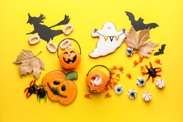 Halloween composition with tasty treats on color background