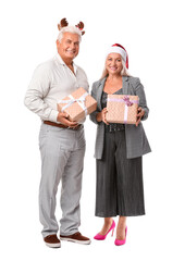 Elderly couple with Christmas gifts on white background